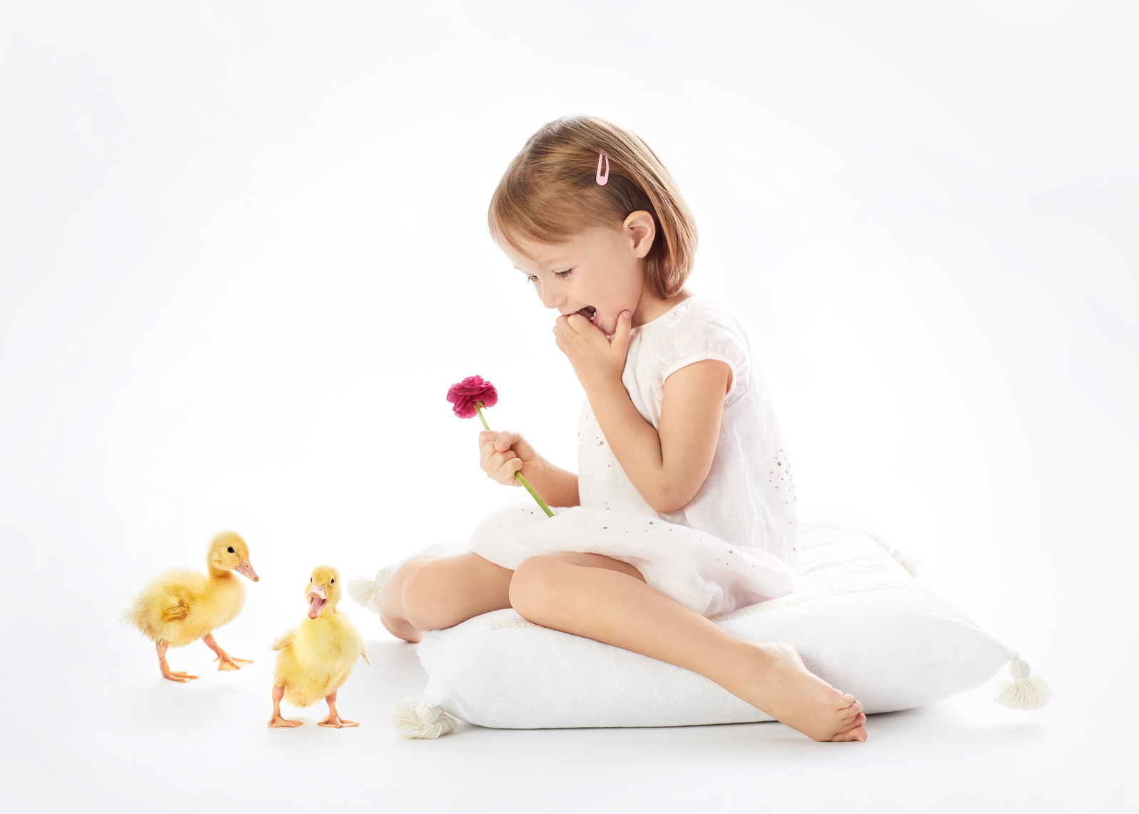 Girl with ducklings and flower